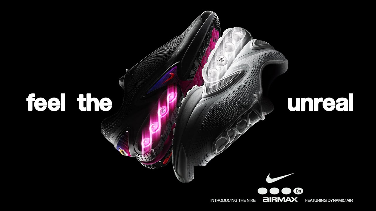 A imagem é de uma campanha do tênis Airmax da Nike. Aparece um par de tênis pretos e a frase “Feel the unreal”.